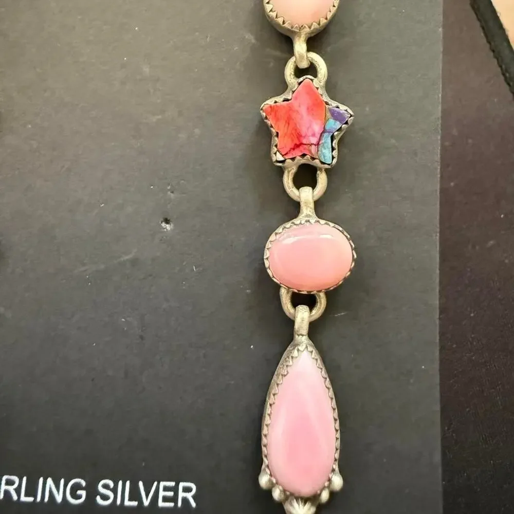 Beautiful handmade long sterling silver pink conch earrings
